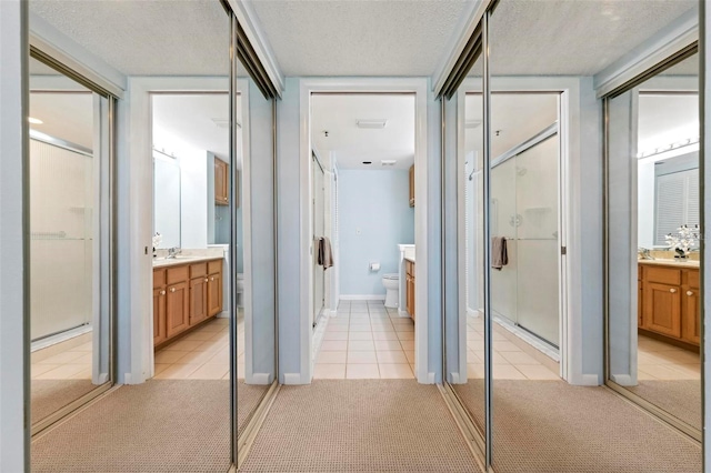 849 Wexford Blvd Unit 849, Venice, FL 34293 - full bath featuring a stall shower, tile patterned floors, vanity, and a textured ceiling