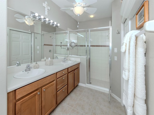29704 Niagara Ct, Englewood, FL 34223 - full bath with a ceiling fan, double vanity, a shower stall, and tile patterned floors