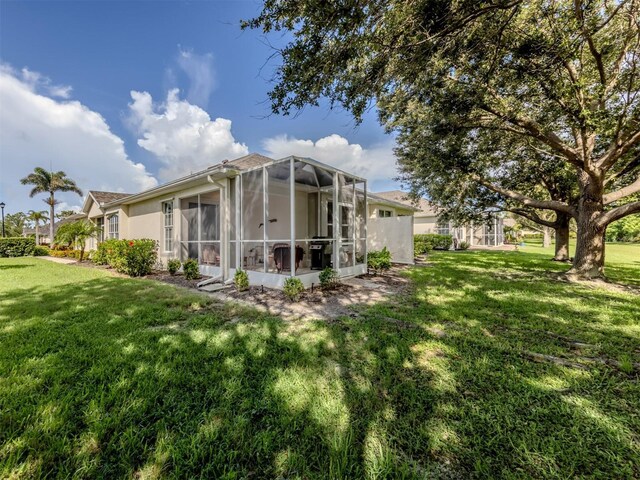 29704 Niagara Ct, Englewood, FL 34223 - rear view of house featuring a lawn and stucco siding