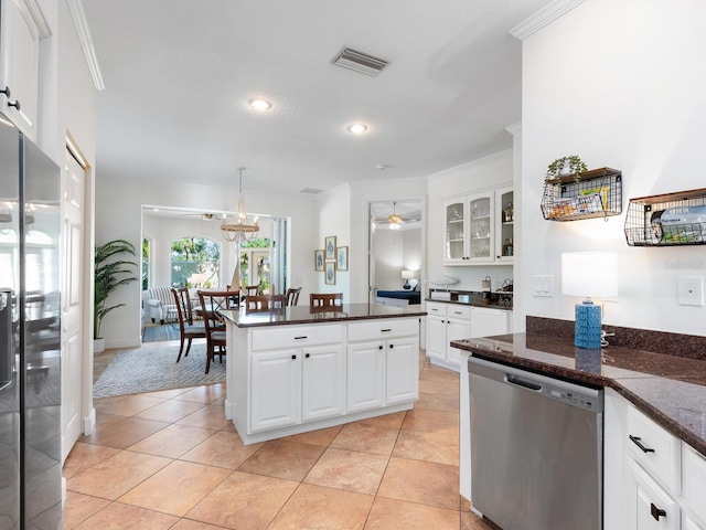 1164 Beachcomber Ct Unit 19, Osprey, FL 34229 - kitchen with appliances with stainless steel finishes, glass insert cabinets, white cabinets, light tile patterned floors, and ornamental molding