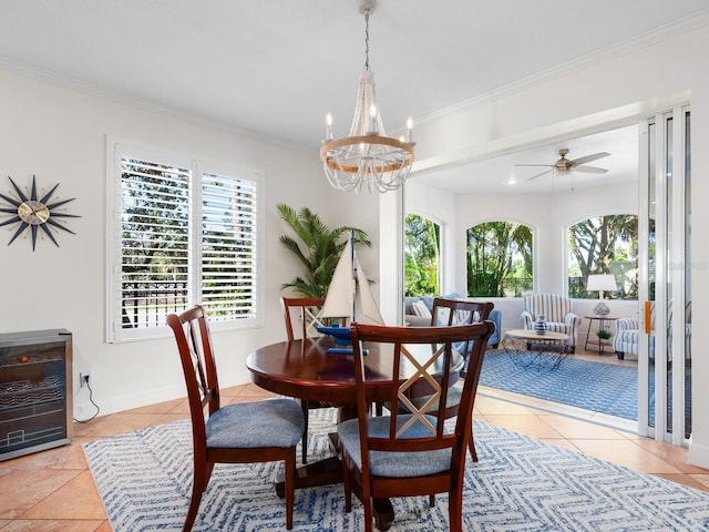 1164 Beachcomber Ct Unit 19, Osprey, FL 34229 - dining area with light tile patterned floors, plenty of natural light, a chandelier, crown molding, and wine cooler