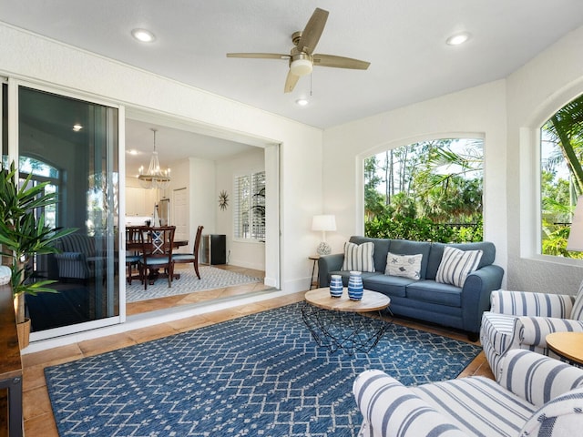 1164 Beachcomber Ct Unit 19, Osprey, FL 34229 - living area with a chandelier, recessed lighting, tile patterned flooring, and a ceiling fan