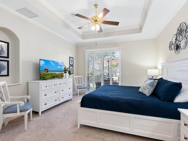 1164 Beachcomber Ct Unit 19, Osprey, FL 34229 - bedroom featuring a raised ceiling, crown molding, access to exterior, light colored carpet, and a ceiling fan
