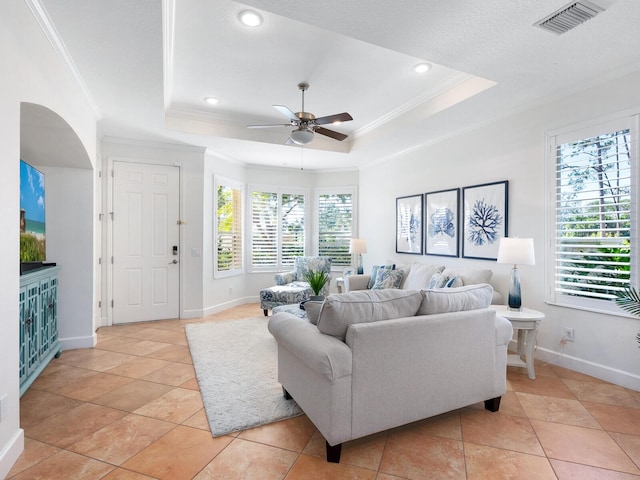 1164 Beachcomber Ct Unit 19, Osprey, FL 34229 - living area featuring ornamental molding, a tray ceiling, ceiling fan, recessed lighting, and light tile patterned flooring