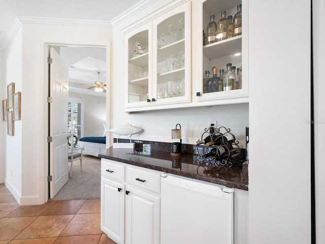 1164 Beachcomber Ct Unit 19, Osprey, FL 34229 - bar area featuring white dishwasher, crown molding, a ceiling fan, light carpet, and light tile patterned floors
