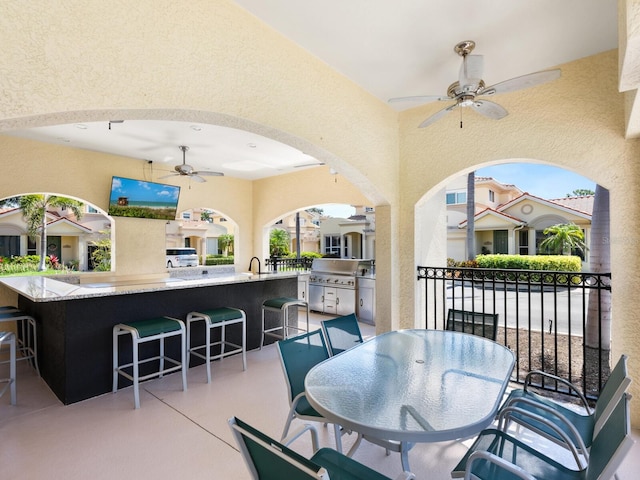 1164 Beachcomber Ct Unit 19, Osprey, FL 34229 - view of patio featuring ceiling fan and exterior kitchen