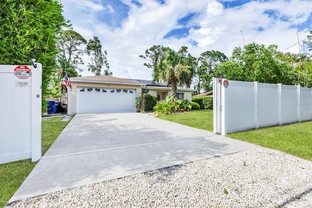 2445 Apache St, Sarasota, FL 34231 - single story home with driveway, an attached garage, stucco siding, and solar panels