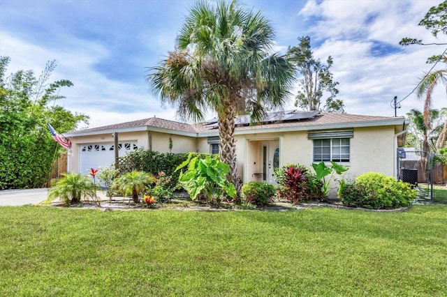2445 Apache St, Sarasota, FL 34231 - single story home featuring stucco siding, a garage, solar panels, and concrete driveway