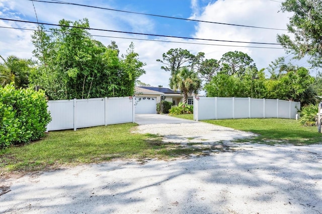 2445 Apache St, Sarasota, FL 34231 - fenced yard featuring driveway and a garage