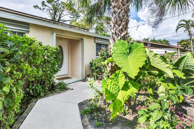 2445 Apache St, Sarasota, FL 34231 - view of exterior entry with stucco siding
