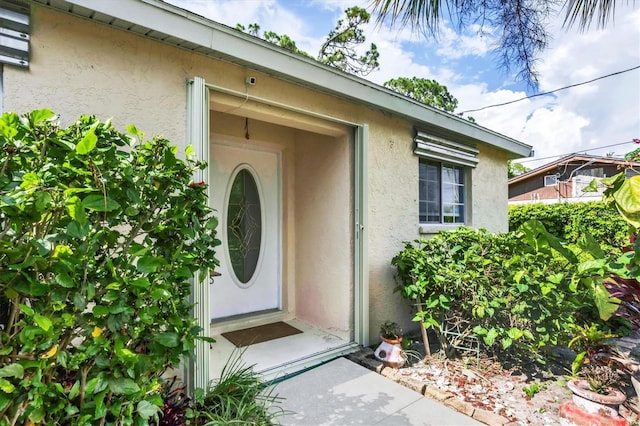 2445 Apache St, Sarasota, FL 34231 - view of exterior entry with stucco siding