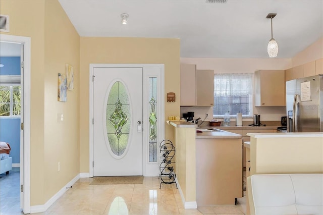 2445 Apache St, Sarasota, FL 34231 - foyer entrance with healthy amount of natural light and light tile patterned flooring