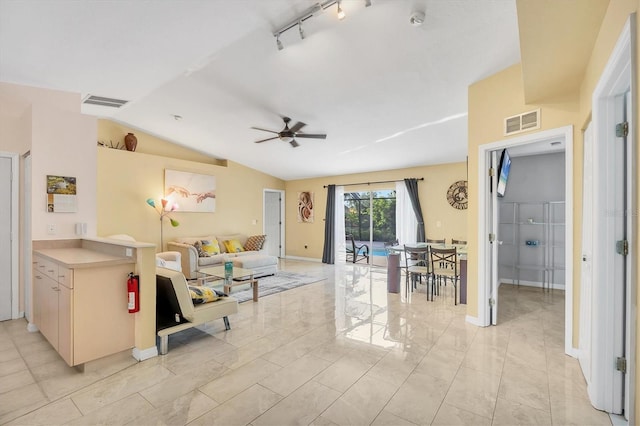 2445 Apache St, Sarasota, FL 34231 - living room with a ceiling fan and vaulted ceiling