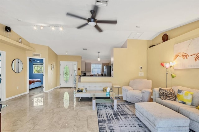 2445 Apache St, Sarasota, FL 34231 - living area featuring a ceiling fan, vaulted ceiling, and track lighting