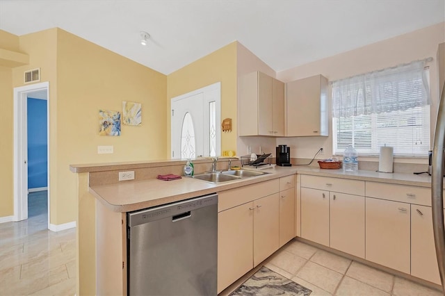 2445 Apache St, Sarasota, FL 34231 - kitchen with dishwasher, a peninsula, light countertops, and cream cabinetry
