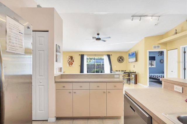 2445 Apache St, Sarasota, FL 34231 - kitchen with stainless steel appliances, light countertops, a ceiling fan, and track lighting