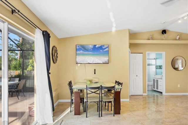 2445 Apache St, Sarasota, FL 34231 - dining space with vaulted ceiling and baseboards