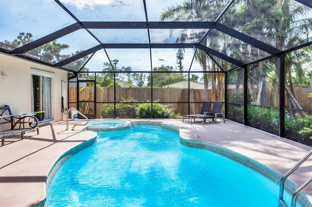 2445 Apache St, Sarasota, FL 34231 - view of pool with a fenced backyard, a patio area, a pool with connected hot tub, and glass enclosure
