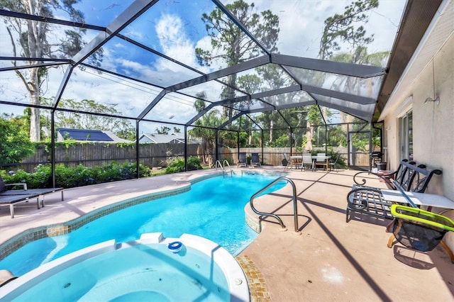2445 Apache St, Sarasota, FL 34231 - view of pool with a pool with connected hot tub, a patio area, and a fenced backyard