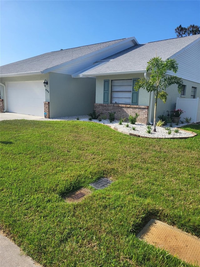 482 Pendleton Pl, Venice, FL 34292 - ranch-style home with brick siding, a garage, stucco siding, a shingled roof, and concrete driveway
