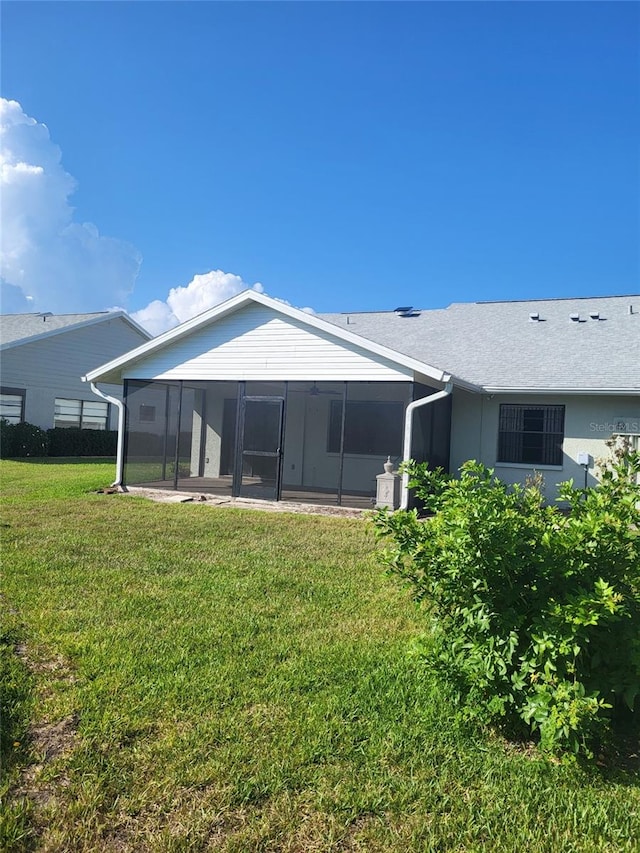 482 Pendleton Pl, Venice, FL 34292 - rear view of property featuring a sunroom and a yard