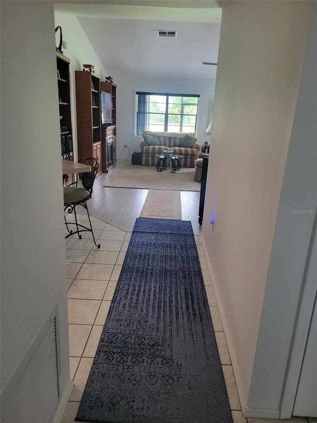 482 Pendleton Pl, Venice, FL 34292 - corridor featuring light tile patterned floors