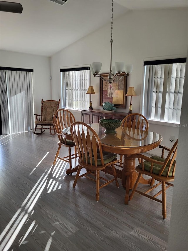 482 Pendleton Pl, Venice, FL 34292 - dining area featuring vaulted ceiling and wood finished floors
