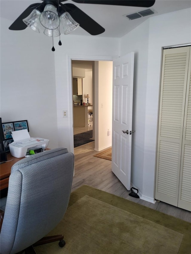 482 Pendleton Pl, Venice, FL 34292 - home office featuring a ceiling fan and light wood finished floors