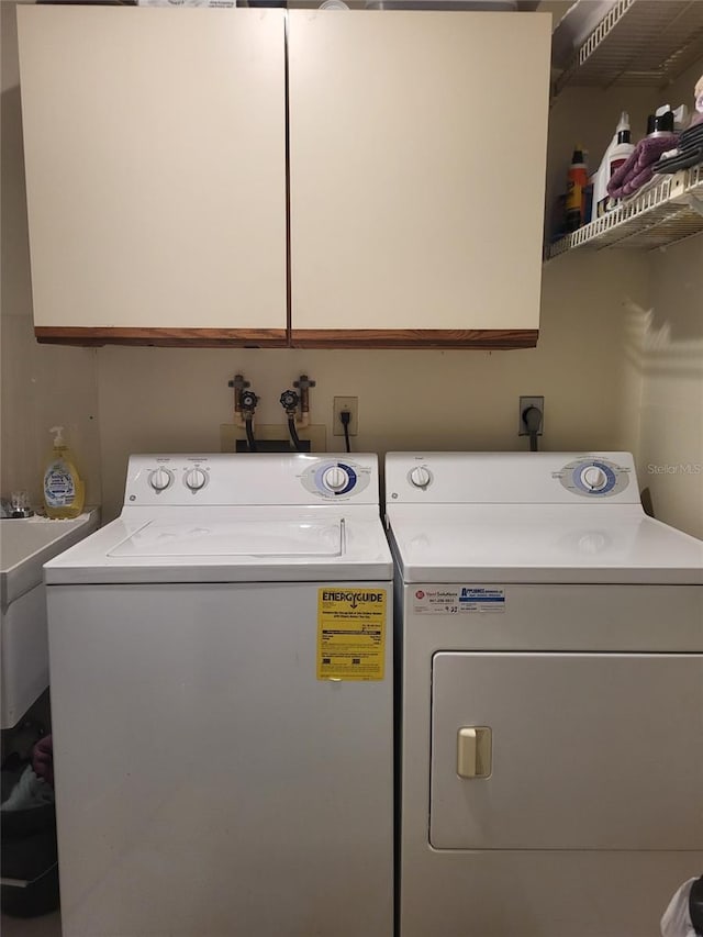 482 Pendleton Pl, Venice, FL 34292 - laundry room featuring cabinet space and independent washer and dryer