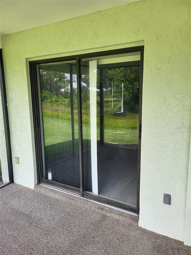 482 Pendleton Pl, Venice, FL 34292 - entryway with a textured wall and carpet flooring