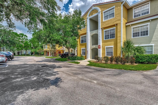 5459 Bentgrass Dr Unit 2-304, Sarasota, FL 34235 - view of property with uncovered parking
