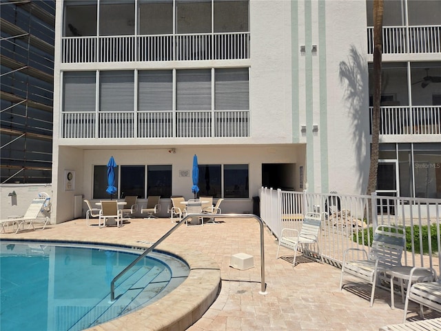 333 The Esplanade N Unit 102, Venice, FL 34285 - community pool featuring a patio area