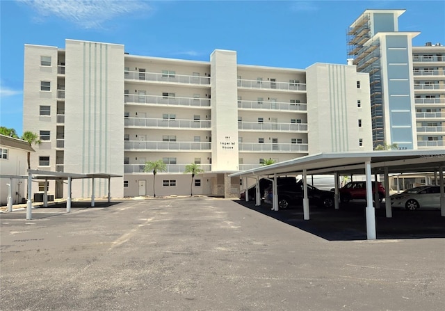 333 The Esplanade N Unit 102, Venice, FL 34285 - view of apartment building / complex featuring covered parking