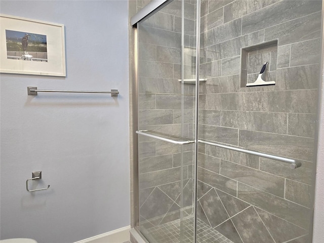 333 The Esplanade N Unit 102, Venice, FL 34285 - bathroom featuring a stall shower