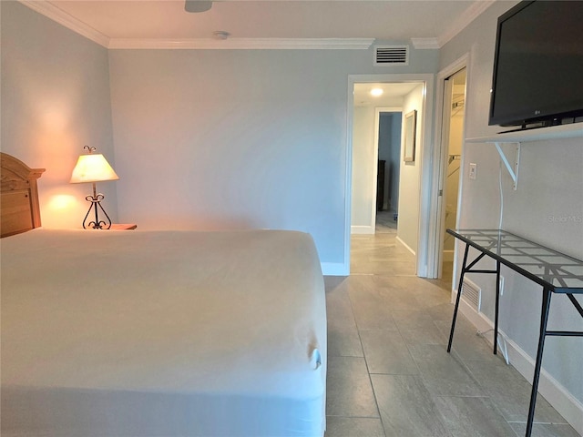 333 The Esplanade N Unit 102, Venice, FL 34285 - tiled bedroom featuring ornamental molding