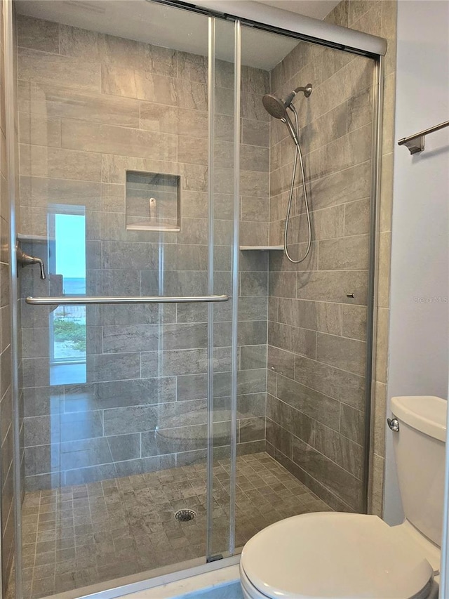 333 The Esplanade N Unit 102, Venice, FL 34285 - bathroom with toilet and a shower stall