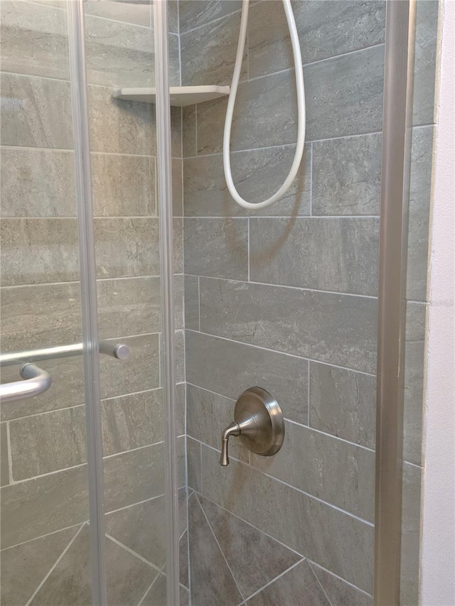 333 The Esplanade N Unit 102, Venice, FL 34285 - bathroom featuring a shower stall