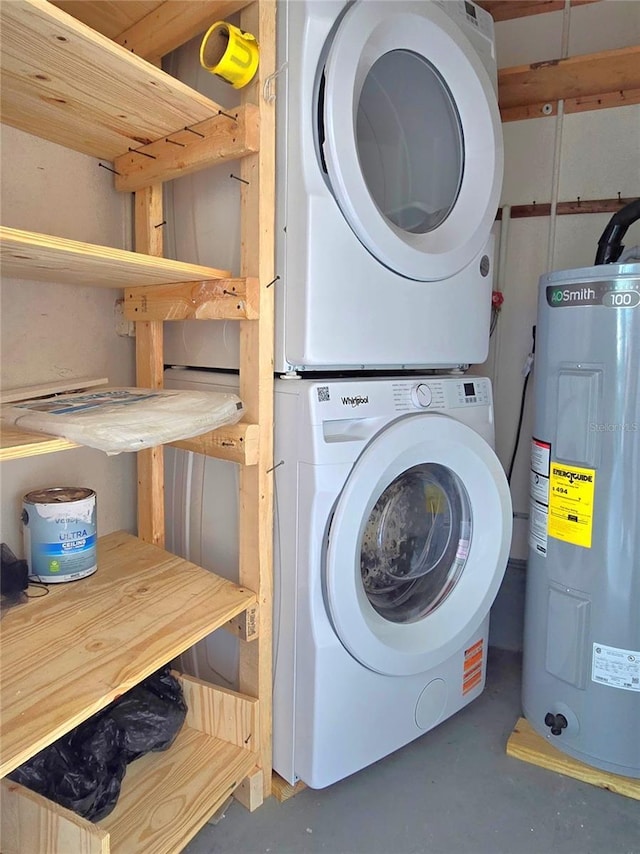 333 The Esplanade N Unit 102, Venice, FL 34285 - washroom with water heater and estacked washer and dryer