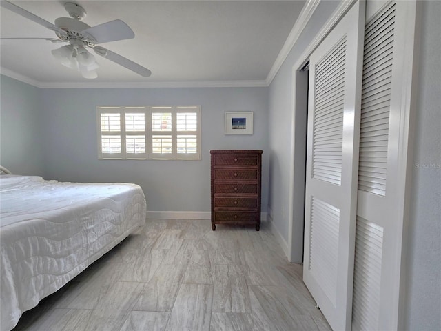 333 The Esplanade N Unit 102, Venice, FL 34285 - bedroom with ornamental molding, light marble finish flooring, ceiling fan, and a closet