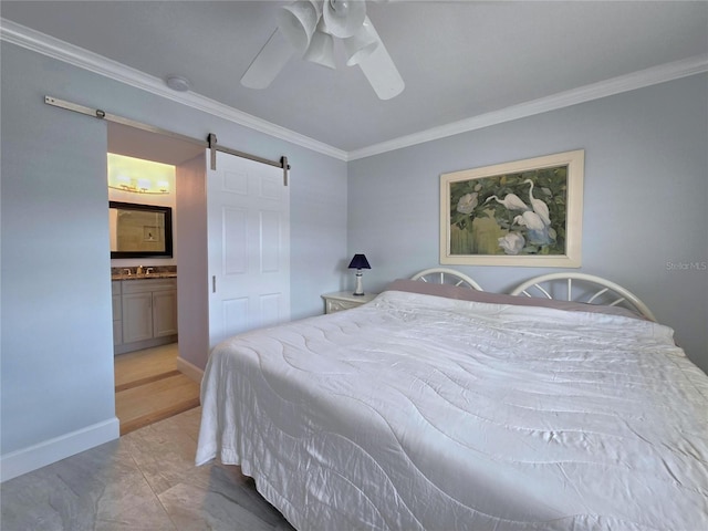 333 The Esplanade N Unit 102, Venice, FL 34285 - bedroom featuring crown molding, a barn door, ceiling fan, and ensuite bathroom
