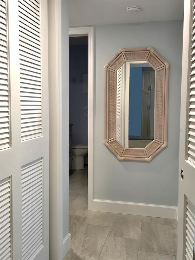 333 The Esplanade N Unit 102, Venice, FL 34285 - hallway featuring a heating unit and marble finish floors