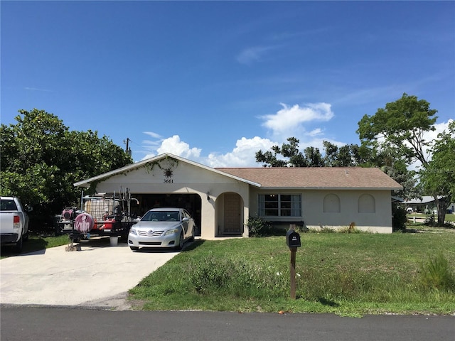 3661 Sterling Rd, Venice, FL 34293 - single story home with a front lawn, an attached garage, stucco siding, and concrete driveway