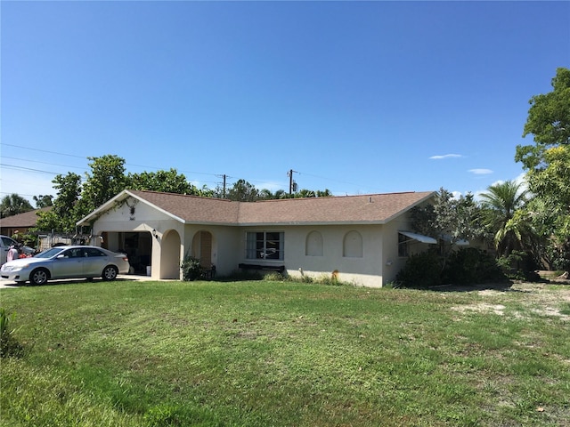 3661 Sterling Rd, Venice, FL 34293 - single story home with a front yard, stucco siding, a garage, and roof with shingles