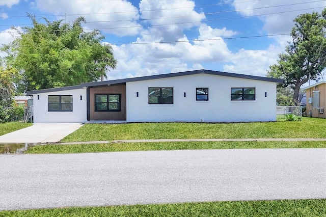 6821 Marius Rd, North Port, FL 34287 - view of front of house with a front lawn and stucco siding