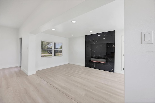 6821 Marius Rd, North Port, FL 34287 - unfurnished living room with wood finished floors and recessed lighting