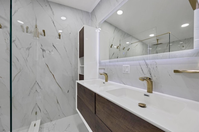 6821 Marius Rd, North Port, FL 34287 - full bathroom with a marble finish shower, double vanity, recessed lighting, and marble finish flooring