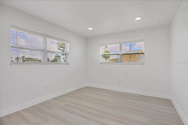6821 Marius Rd, North Port, FL 34287 - empty room with healthy amount of natural light, light wood-style floors, and recessed lighting