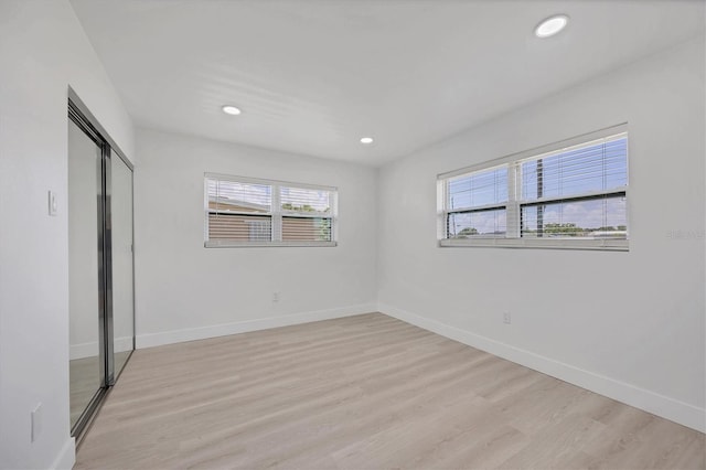 6821 Marius Rd, North Port, FL 34287 - unfurnished bedroom with light wood-style flooring, recessed lighting, and a closet