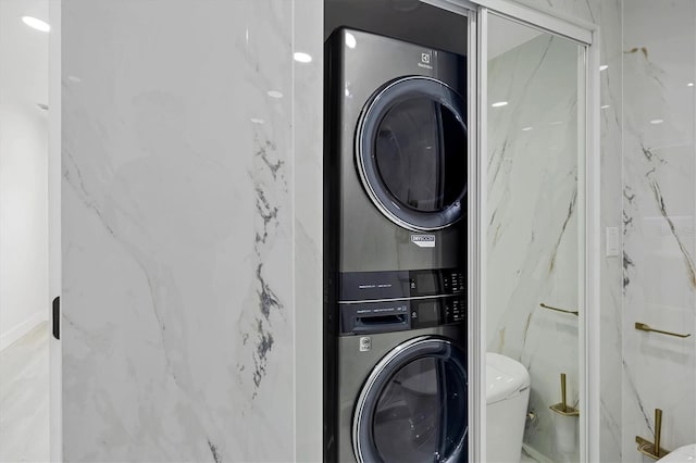 6821 Marius Rd, North Port, FL 34287 - washroom with stacked washer and clothes dryer