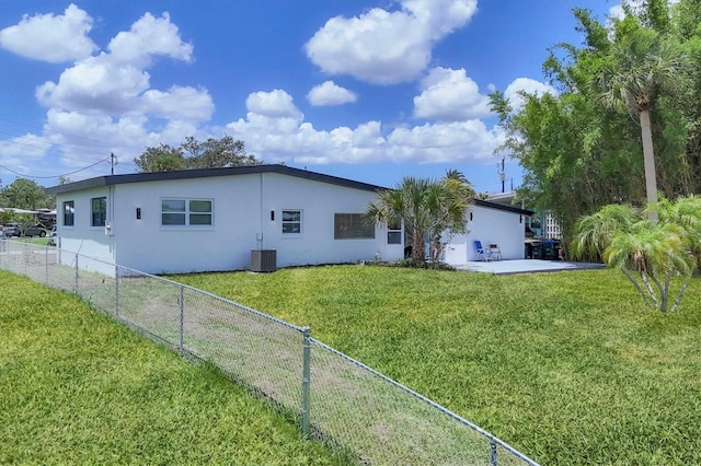 6821 Marius Rd, North Port, FL 34287 - back of house featuring stucco siding, a fenced backyard, and a patio area